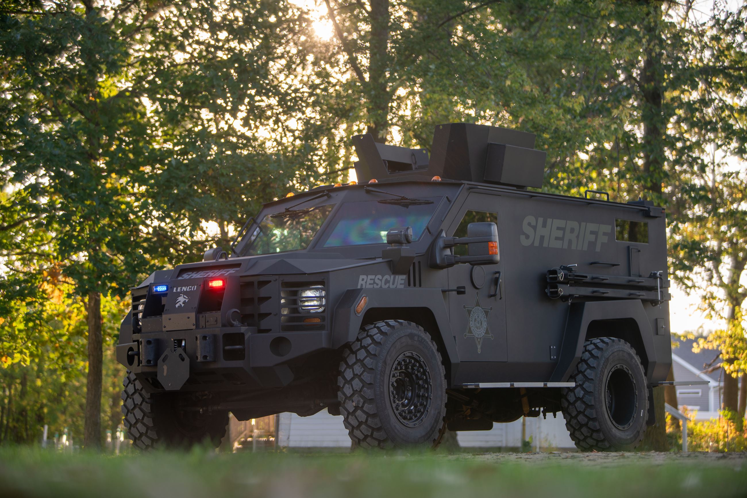 Armored swat vehicle with police lights on.