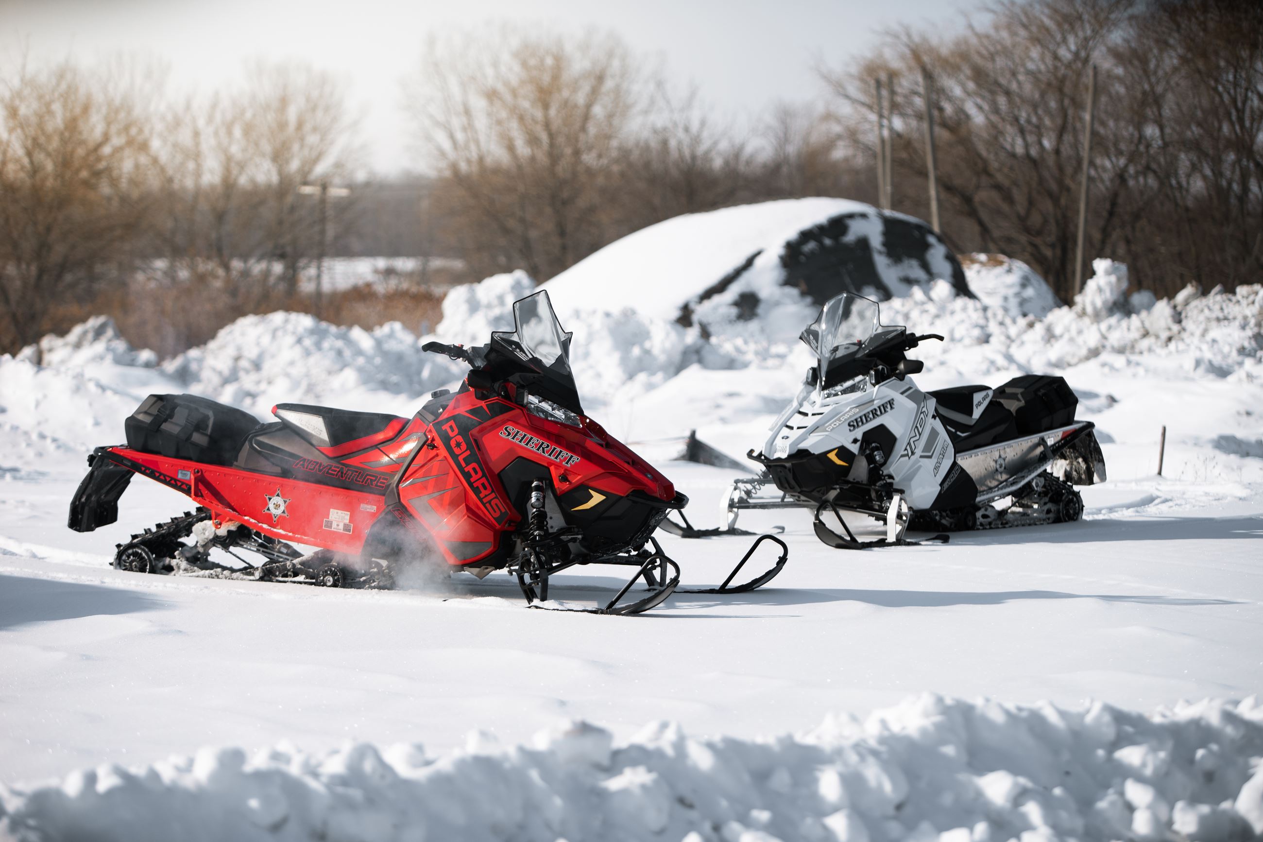 Sheriff's Snowmobiles Patrolling a trail